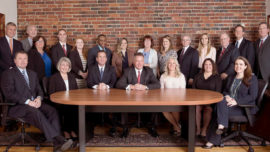 CIP Group team gathered around a table