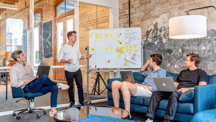 Man giving presentation to co-workers