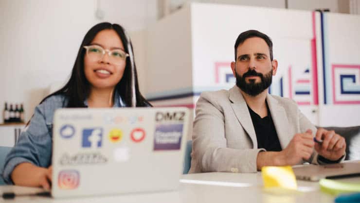 Woman and man at a conference table