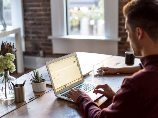 Man working on his laptop at a desk