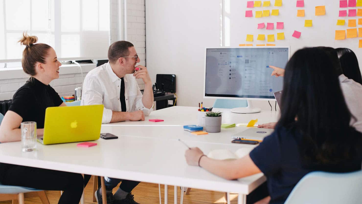 Workers collaborating together at a table