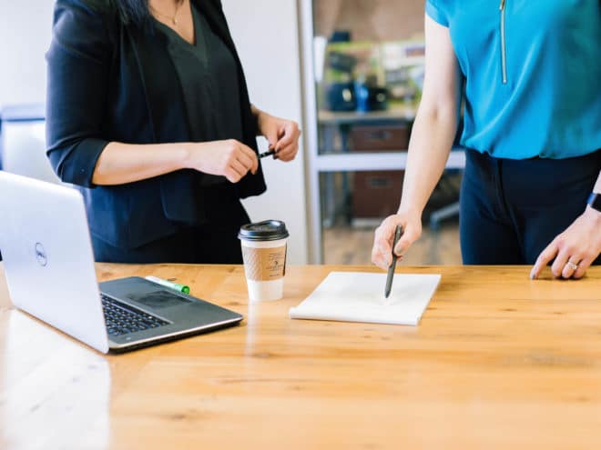 Two people working together on a document